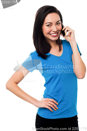 Image of Young girl speaking over cellphone