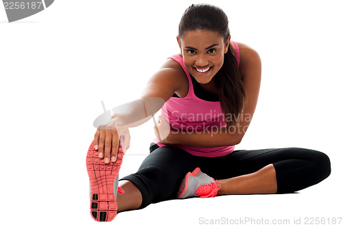 Image of Fitness girl doing stretching exercise