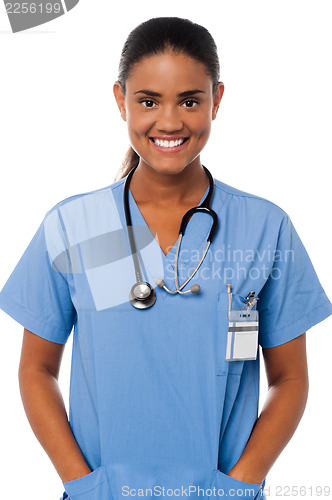 Image of Young female doctor with hands in pocket