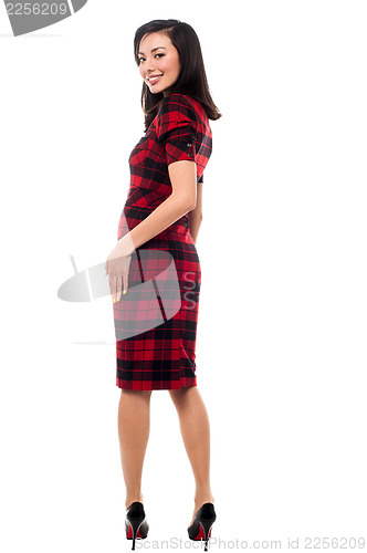 Image of Beautiful asian girl looking over her shoulder