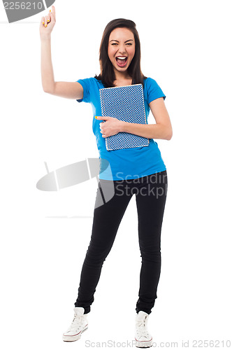 Image of Excited young university student shouting loud