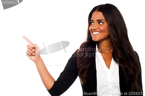 Image of Corporate lady pointing towards copy space area