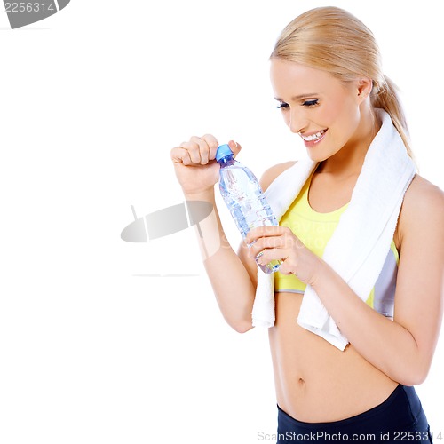 Image of Sporty blond woman posing with water bottle