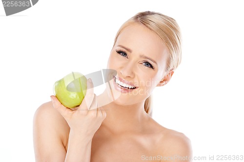 Image of Adorable and healthy woman holding apple