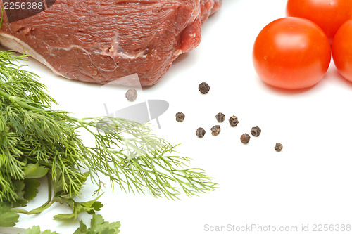 Image of Piece of beef and vegetables on white