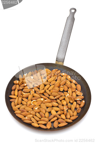 Image of Pan with roasted almonds on white background