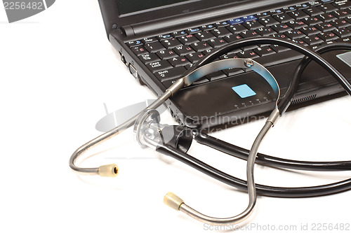 Image of Stethoscope and laptop
