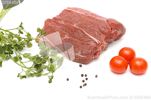 Image of Piece of beef and vegetables on white