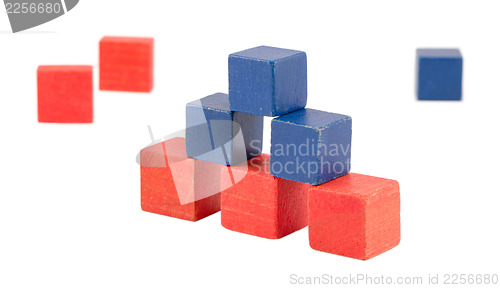 Image of pyramid made wood color toy bricks blocks isolated 