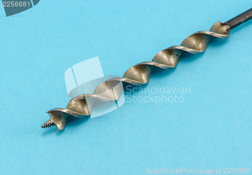 Image of special wood drill bit on blue background 