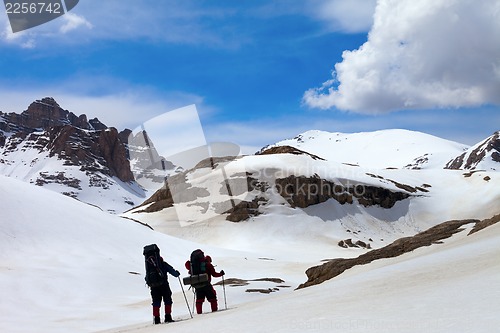 Image of Two hikers in snow mountains