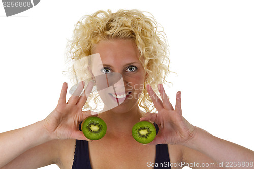 Image of Young woman holding Kiw Fruit
