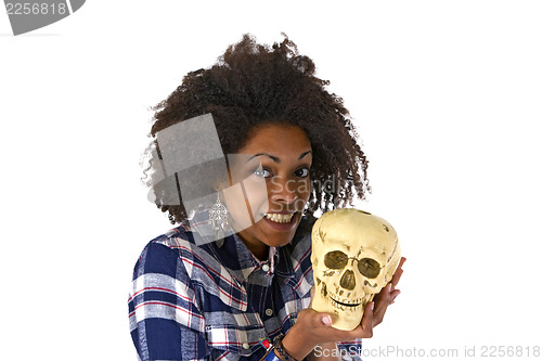 Image of Female afro american woman with human skull model