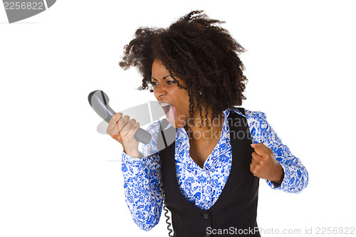 Image of Angry african american woman with handset