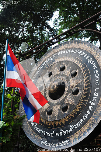 Image of Thai National Flag and Buddhist bell