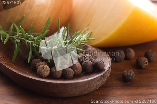 Image of allspice with fresh rosemary, cheese and onion