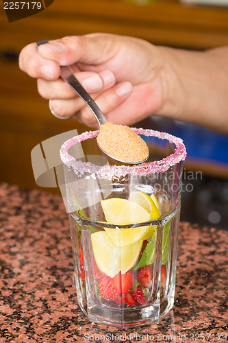 Image of Preparing a strawberry mojito