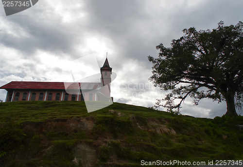 Image of Church and Tree on the Hill.