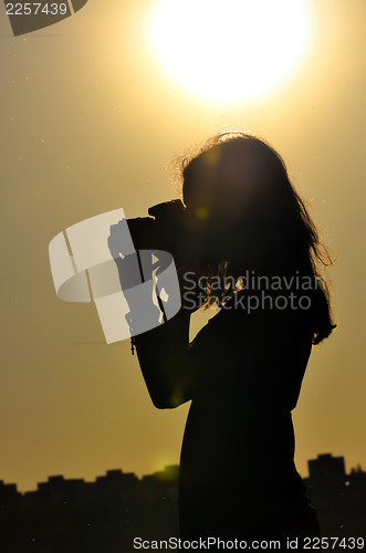 Image of silhouette of girl in shooting time