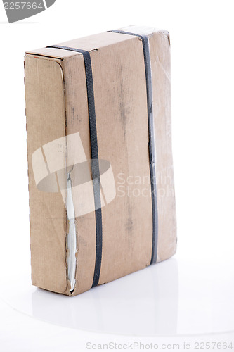 Image of Cardboard box strapped with tape