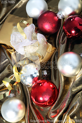 Image of Christmas baubles on gold fabric