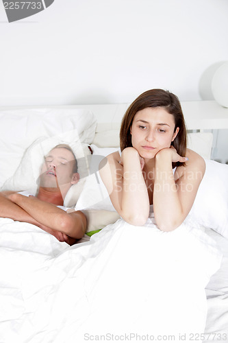 Image of Snoring man, distraught woman