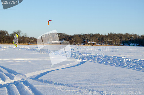 Image of people kiteboard ice sail frozen lake snow winter 