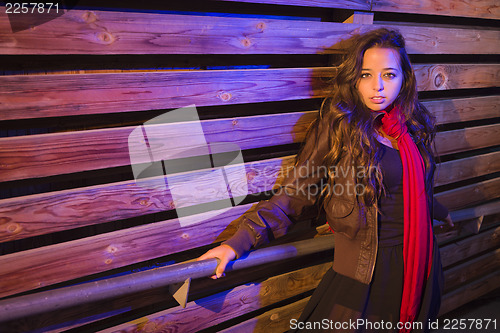 Image of Mixed Race Young Adult Woman Against a Wood Wall Background