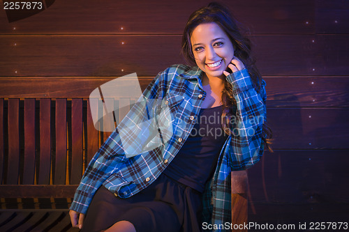 Image of Mixed Race Young Adult Woman Portrait Sitting on Wood Bench