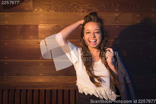 Image of Mixed Race Young Adult Woman Portrait Against Wooden Wall