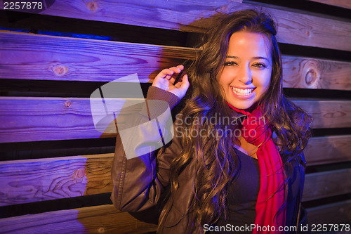 Image of Mixed Race Young Adult Woman Against a Wood Wall Background