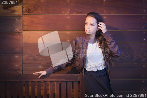 Image of Mixed Race Young Adult Woman Portrait Against Wooden Wall