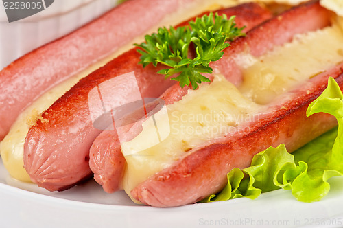 Image of sausages with cheese and omelette