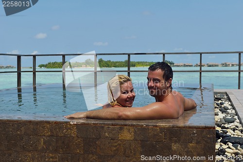 Image of happy young  couple at summer vacation have fun and relax at bea