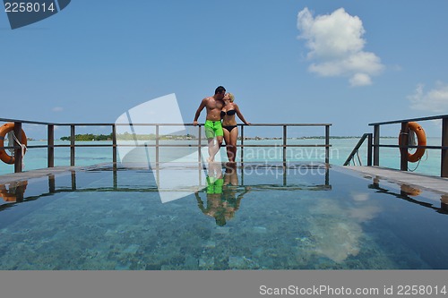 Image of happy young  couple at summer vacation have fun and relax at bea