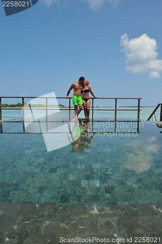 Image of happy young  couple at summer vacation have fun and relax at bea