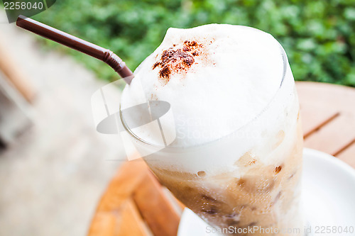 Image of Refreshing glass of iced blended frappucino with milk foam