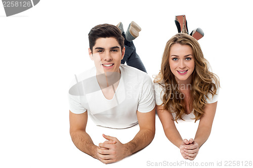 Image of Young couple lying on the floor