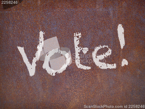 Image of vote sign on a rusty steel plate