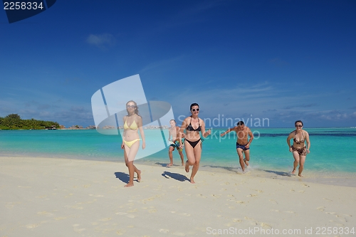 Image of group of happy young people have fun on bach