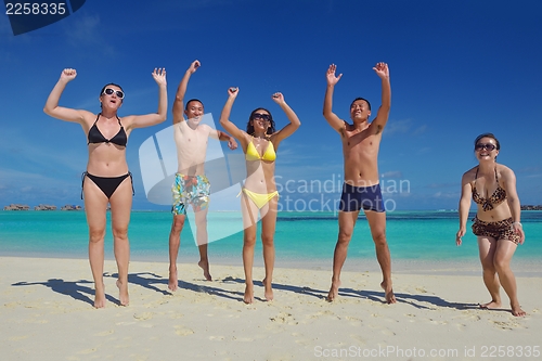 Image of group of happy young people have fun on bach