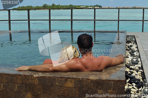 Image of happy young  couple at summer vacation have fun and relax at bea