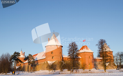 Image of sunset light Trakai castle winter  people tourists 