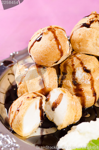 Image of Profiteroles with chocolate syrup