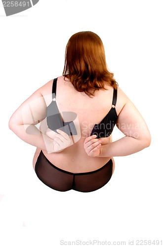 Image of Girl closing her bra.