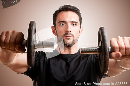 Image of Man Working Out With Dumbbels