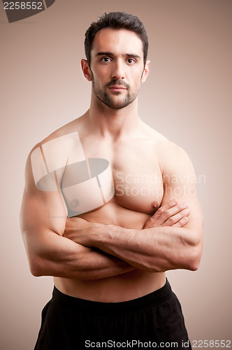 Image of Fit Man Standing With Arms Crossed