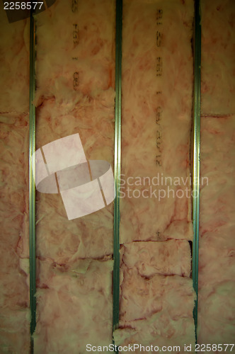 Image of building wall exposed steel studs with insulation