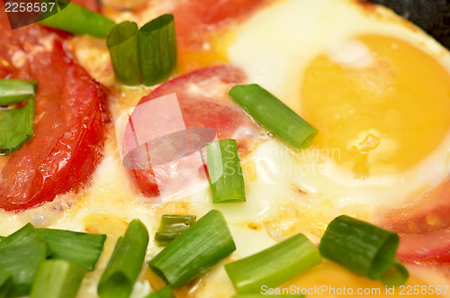 Image of Fried egg with tomatoes and onion