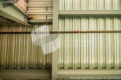 Image of exposed underside of steel floor or roof deck with utilities and